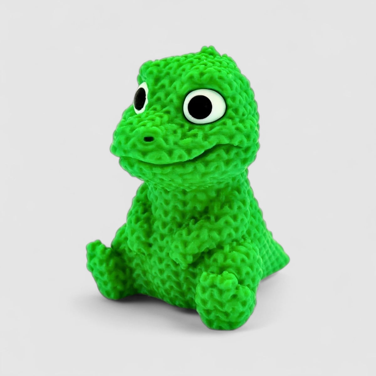 Chompy the Knitted Crocodile, 3D printed figure on grey background | sgc-photo-v1