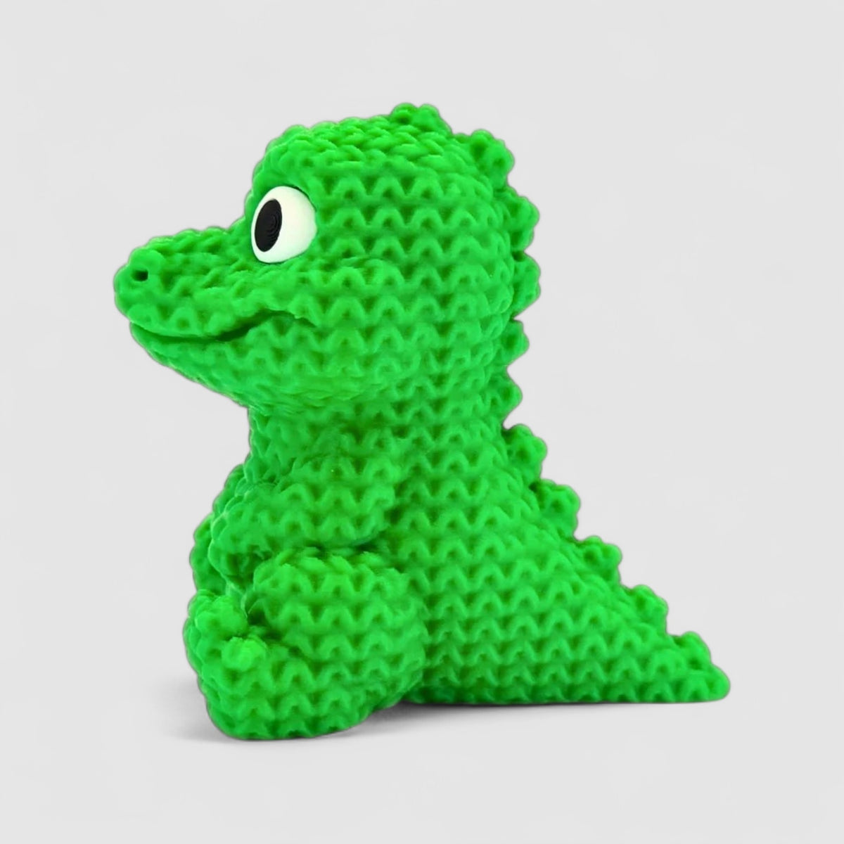 Chompy the Knitted Crocodile, 3D printed figure on grey background | sgc-photo-v1