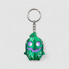 Green spooky sprite keychain with silver ring and chain hardware on grey background