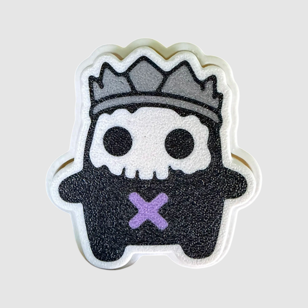 King 3D printed clicker on grey