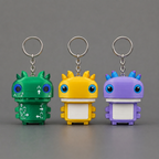 Revised keychain group matching the existing photo’s upright figures and rings above their heads